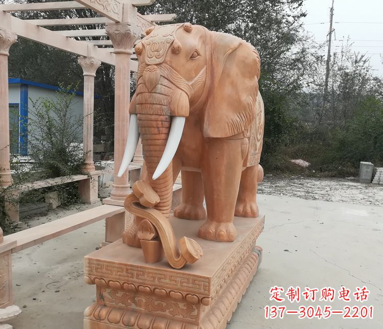 沈阳鼻卷如意的大象晚霞红门口镇宅石雕