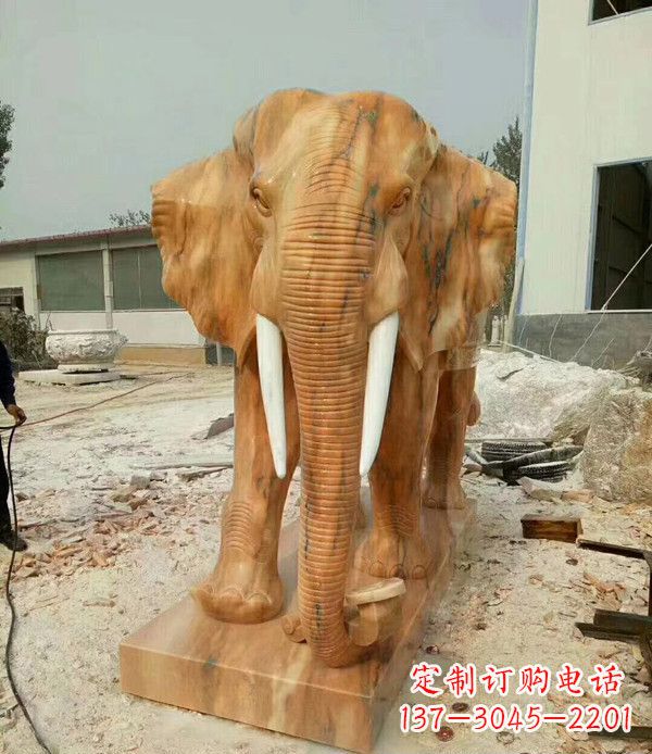 沈阳鼻卷如意晚霞红招财大象石雕