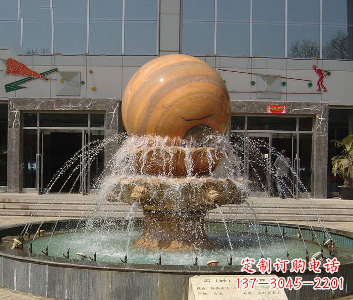 沈阳石来运转球晚霞红风水球石雕
